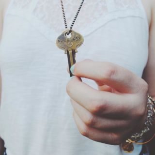 Someone has a key in her hand